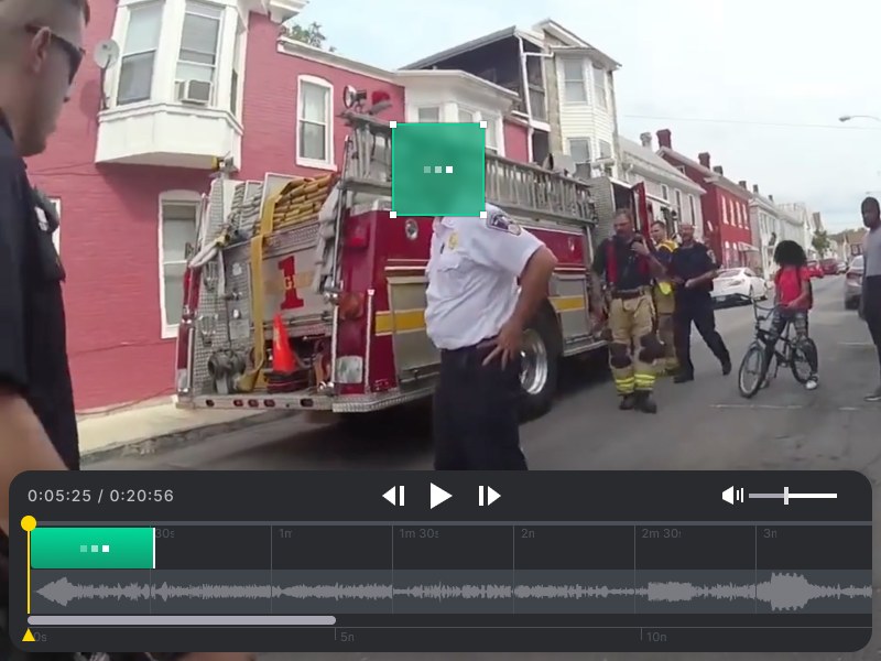 Redaction Studio player: a redaction box over a face in body-camera footage, with the redaction clip on the timeline below